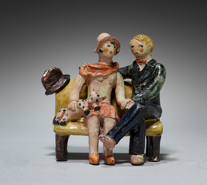Figure of a Couple Sitting on a Bench