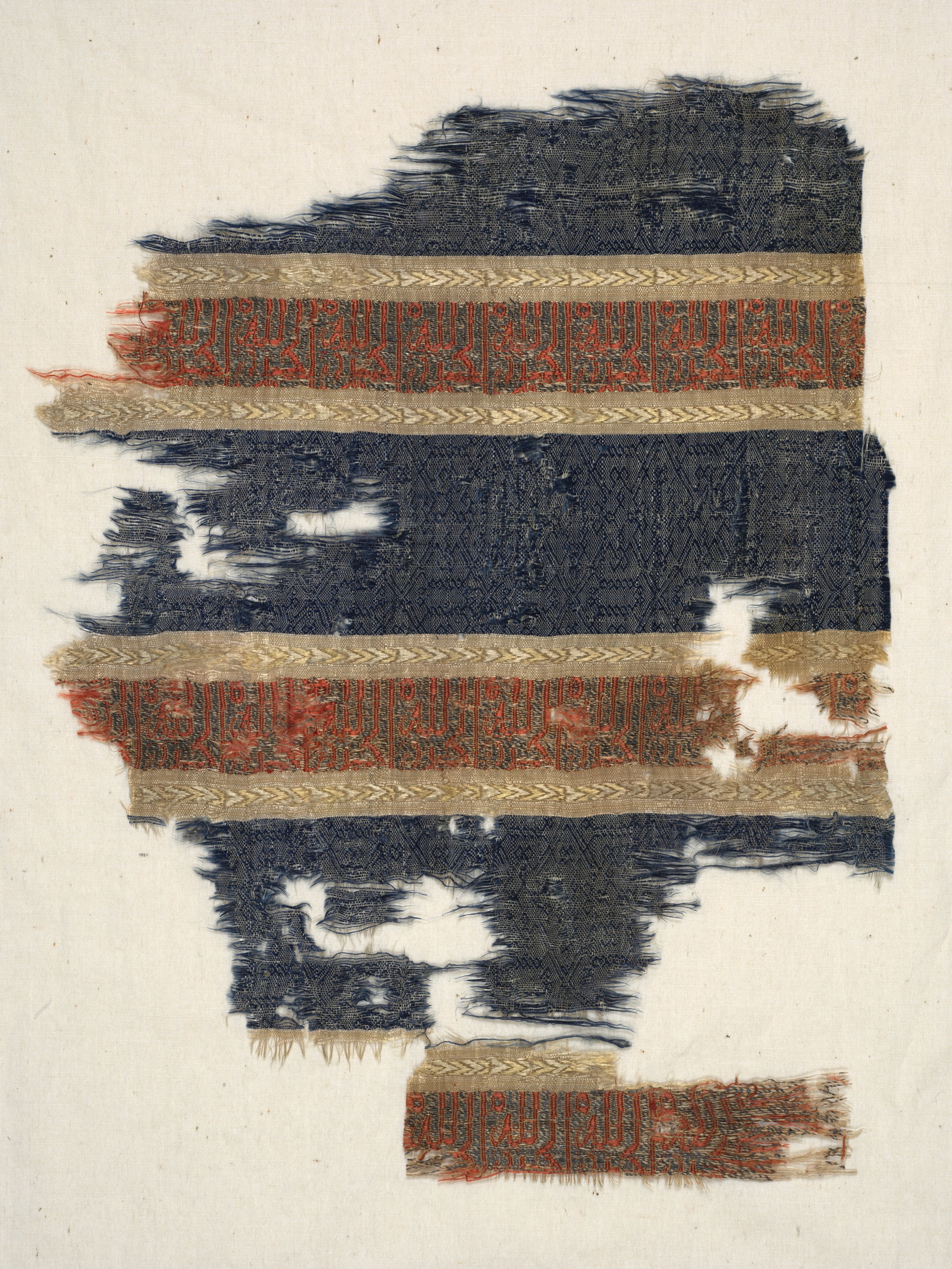 Silk fragment with decorated and inscribed bands, from the tomb of Don Felipe